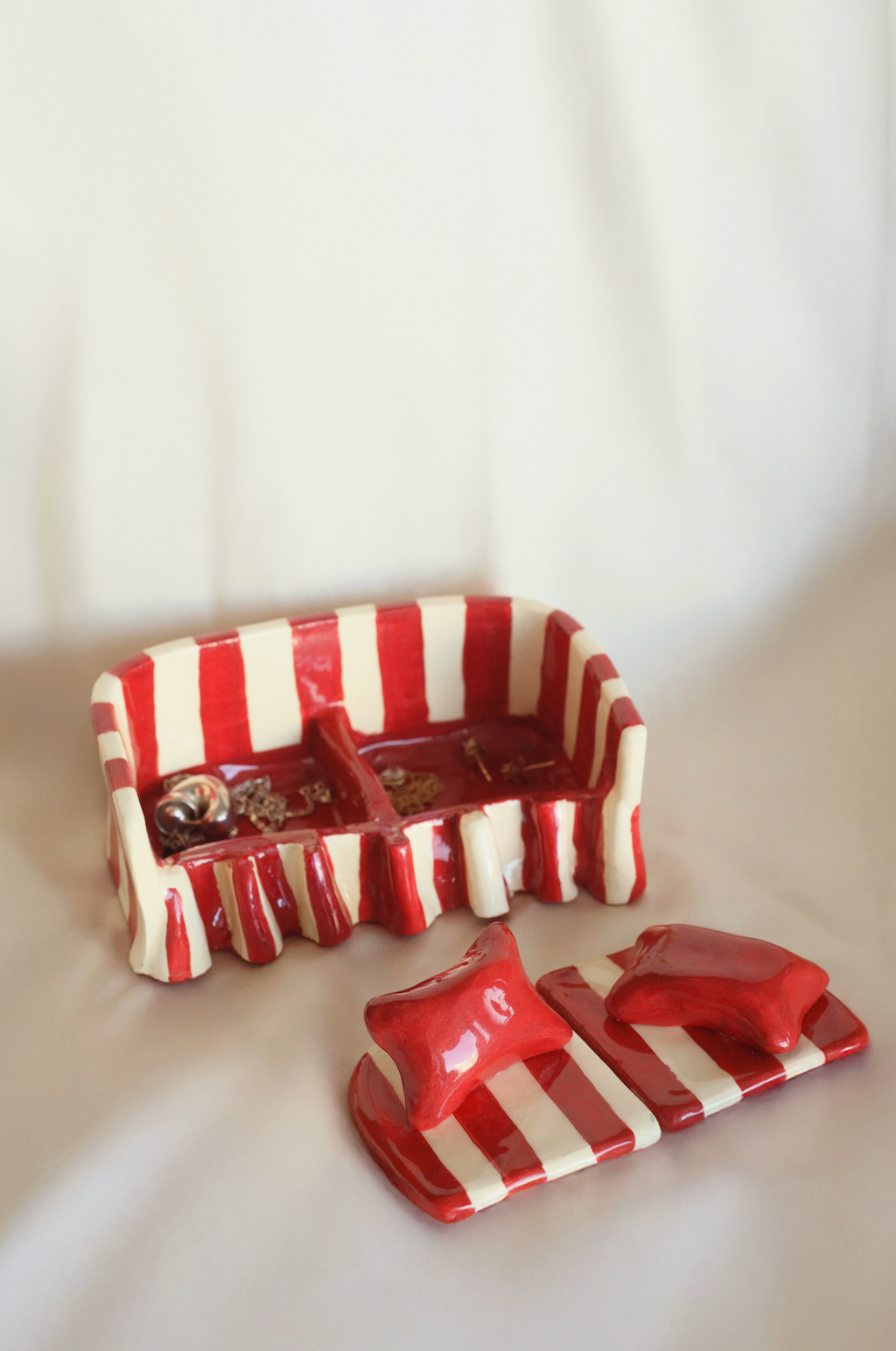 Red and white striped sofa jewelry holder with storage compartment